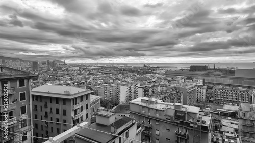 Panoramic View of Genoa Cityscape and Bustling Port, Italy