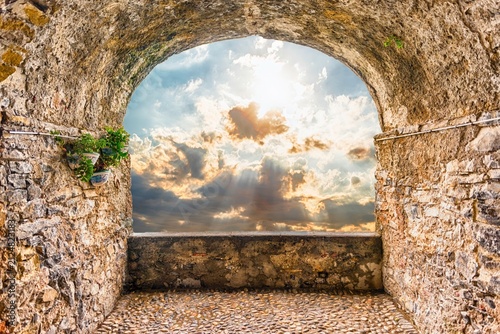 Ancient Stone Archway View to Dramatic Sunset Sky