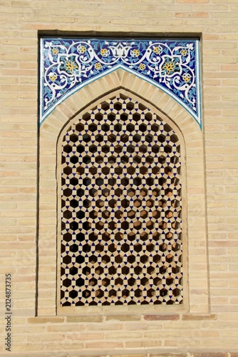 A new window made of brick and tile. The window features traditional Uzbek motifs.