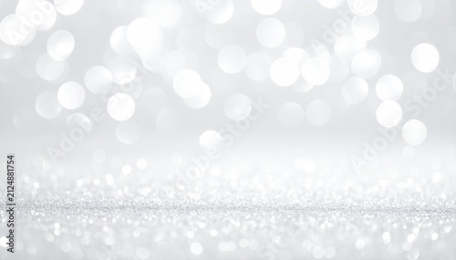 Shimmering, bright, bokeh backdrop. Sparkling particles create a dreamy, festive, and elegant atmosphere