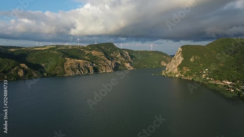 Aerial view on the Danube river and mountains in Djerdap National Park at sunset, Wind Turbines on hills, 4k