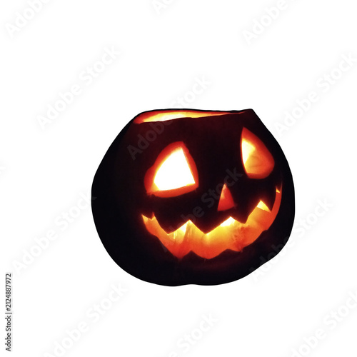 A dark-colored Halloween pumpkin with bright yellow illuminated eyes and a smile, isolated on a transparent background.