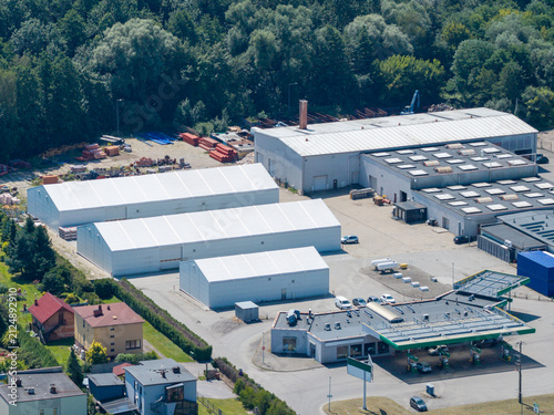 Fotografie Aerial view of industrial park with factories, temporary warehouses, and gas sta