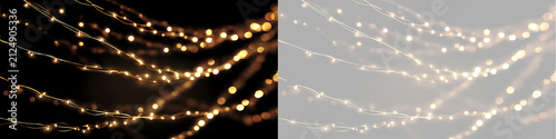 Draped golden fairy lights garland on transparent and black background overlay. Glowing holiday light string bokeh effect