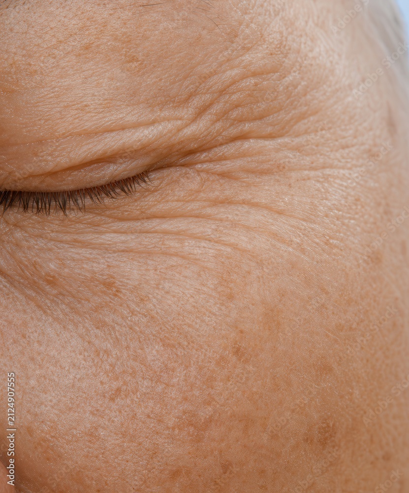 Fototapeta premium Close up of mature woman eye with fine lines and wrinkles
