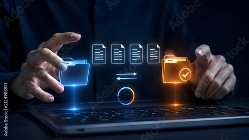 Concept of data migration and synchronization with glowing digital folders and files exchanging information over a laptop keyboard.