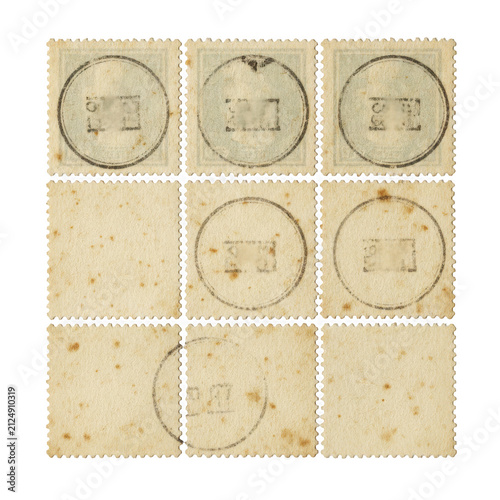Canvastavla Old vintage postage stamps with ink postmarks on textured paper