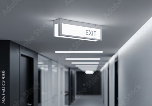Glowing Emergency Exit Sign in a Modern Minimalist Office Hallway