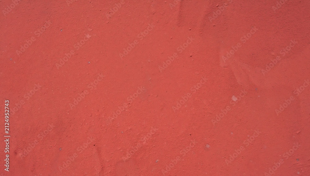 Fototapeta premium Red Textured Surface with Subtle Imperfections in Natural Light