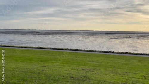 Long pan at sunset of the North Sea coast, Wadden Sea at Elpersbüttel, Germany