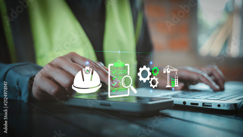 Industrial construction safety standard and quality audit concept, engineer using smartphone with virtual holographic icons for building project inspection process.