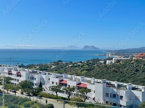Mediterranean Coastal View with Gibraltar Rock and Modern Seaside Homes