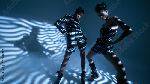 Two Female Models Posing in Avant Garde Fashion Studio