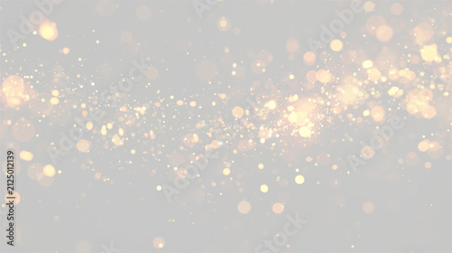 Scattered golden bokeh lights glowing against a dark background with various sizes and soft focus on transparent background