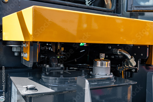 Obraz na płótnie Wheel loader hydraulic oil tank under yellow protective cover
