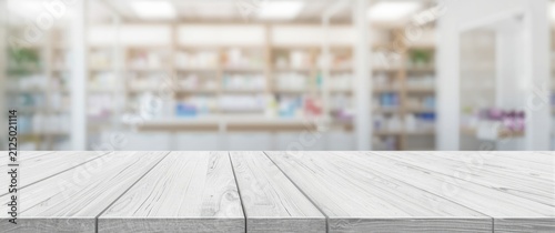 Wooden Table Surface in Front of a Blurred Pharmacy Background