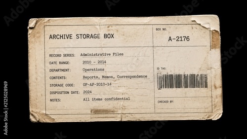 Worn archive storage box label with barcode on black background