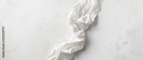 Crumpled White Paper on Textured Light Background