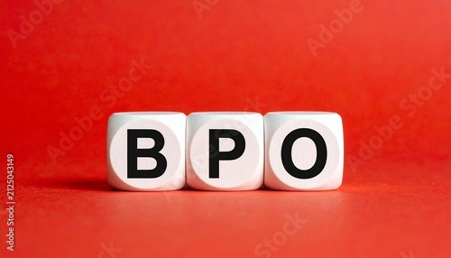 Three white cubes placed side by side against bright red background, each cube printed with single black letter forming acronym “BPO,” visually symbolizing business process outsourcing, relevant in bu