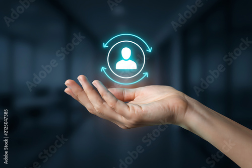 Open hand holding glowing user icon with update arrows for customer lifecycle retention HR continuous support modern corporate business solution