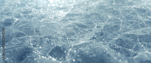 Cracked Ice Surface with Shimmering Frost in Soft Blue Light