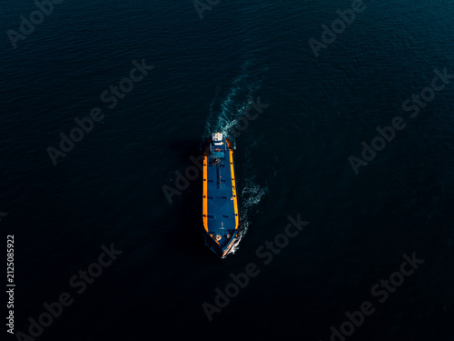 Commercial Cargo Vessel Navigating Open Deep Blue Sea Waters Off The Coast Of Si Racha Chonburi Thailand For Global Maritime Trade