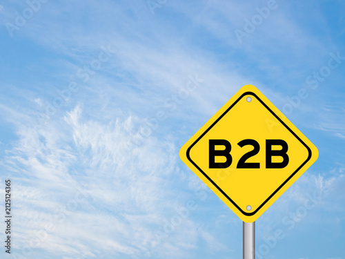 Yellow transportation sign with word b2b (abbreviation of business to business) on blue color sky background
