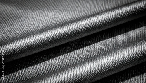 Diagonal woven black fabric texture close up.