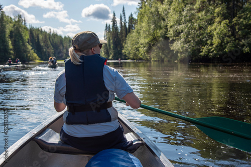 Woman canoeing in Finland Lapland