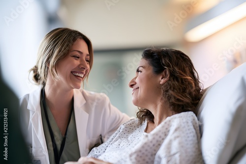 modern inpatient care featuring smiling healthcare professional supporting female patient during recovery realistic hospital lifestyle commercial photography