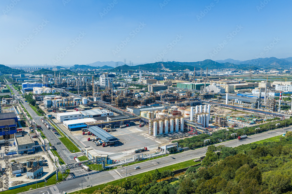 Fototapeta premium Aerial view of a large modern petrochemical plant with storage tanks and processing facilities in China