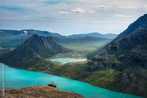 Landscape view of mountain wilderness with lakes and hiker, Besseggen, Jotunheimen, Norway