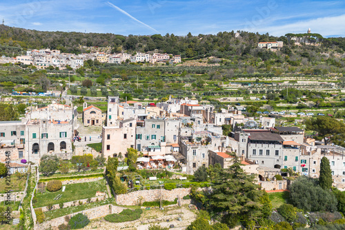 Aerial view of the typical village of Verezzi nestled on a green hillside with terraced gardens, Liguria region, Italy