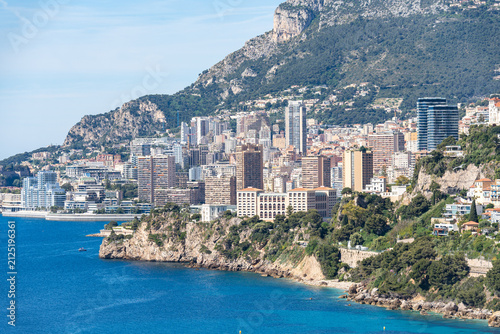 Scenic view of Monaco skyline rising above the blue Mediterranean Sea on the French Riviera