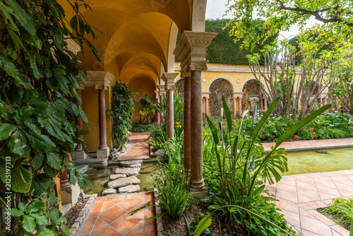 Arcaded Spanish garden with tropical plants at Villa Ephrussi de Rothschild, Saint-Jean-Cap-Ferrat, France