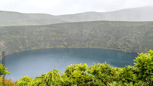 Canvastavla Volcanic crater lake Miradouro da Caldeira Negra e da Caldeira Comprida surrounded by green caldera in the Azores Portugal