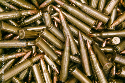 bullets for a machine gun as a background, closeup of photo
