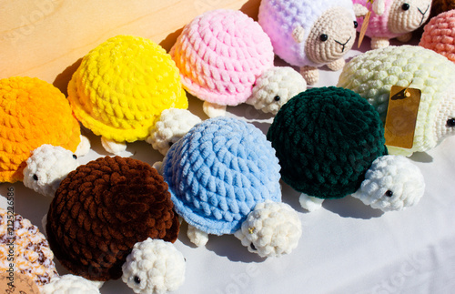 Knitted stuffed animals. Colorful plush toys. Children toys knitted from yarn a gift, a handmade item.
