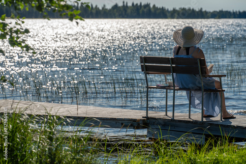 Woman sitting on the beach chair