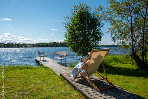 Woman relaxing on the b each chair