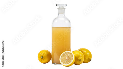 Freshly squeezed yellow lemon juice contained inside a tall clear glass bottle with a stopper and several whole ripe citrus fruits placed on transparent background