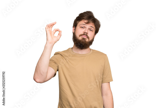Canvas Print Smiling bearded young man showing OK gesture isolated on transparent background, approval, satisfaction, success and positive feedback concept