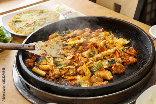 Spicy Korean Chicken Stir Fry Dakgalbi with Vegetables on Iron Pan