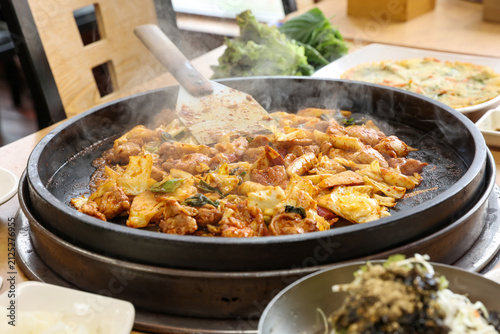Spicy Korean Chicken Stir Fry Dakgalbi with Vegetables on Iron Pan