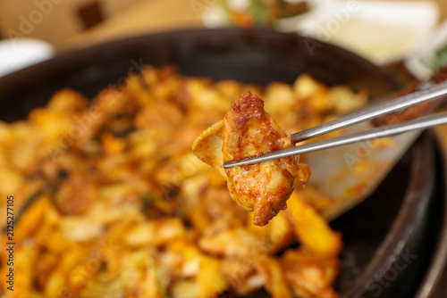 Spicy Korean Chicken Stir Fry Dakgalbi with Vegetables on Iron Pan