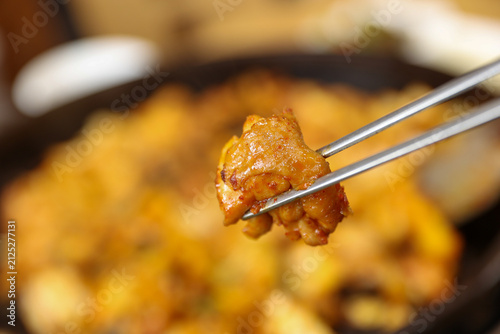 Spicy Korean Chicken Stir Fry Dakgalbi with Vegetables on Iron Pan