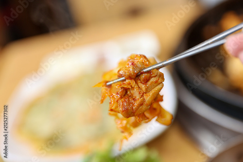 Spicy Korean Chicken Stir Fry Dakgalbi with Vegetables on Iron Pan