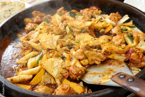 Spicy Korean Chicken Stir Fry Dakgalbi with Vegetables on Iron Pan