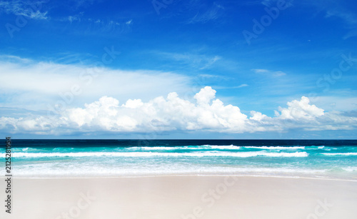 Beach and tropical sea. Blue sky