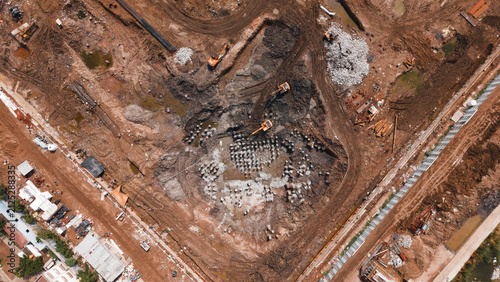 Cuadro en lienzo Cleared demolition and construction site with debris and machinery seen from abo